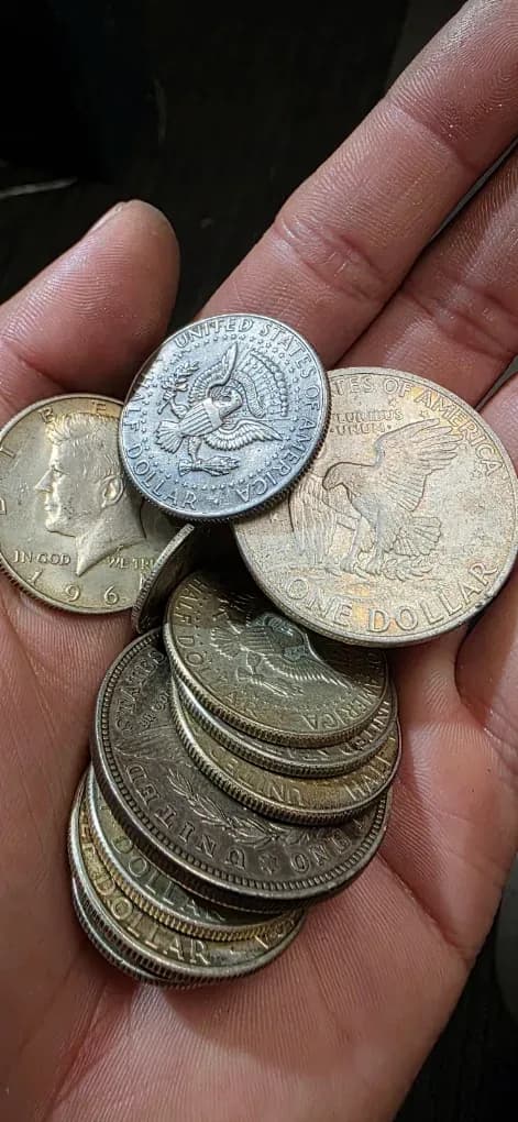 Silver coins weighed and checked on the counter at Don Pepes Loan & Jewelry in Stockton